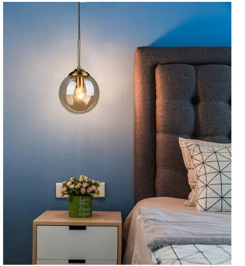 Éclat — Suspension design en verre ambré, lumière chaleureuse & élégante