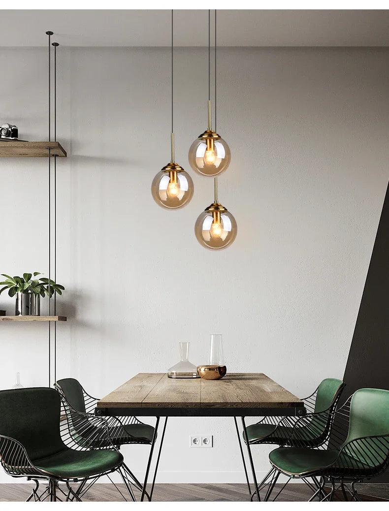 Éclat — Suspension design en verre ambré, lumière chaleureuse & élégante